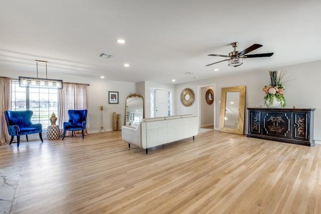 living room featuring recessed lighting, visible vents, light wood-style floors, a ceiling fan, and baseboards