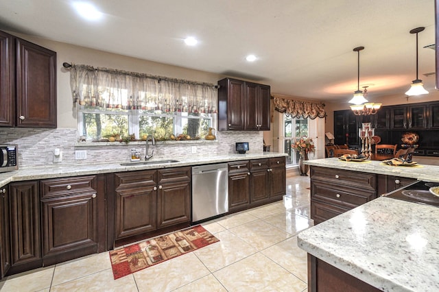 kitchen with stainless steel appliances, dark brown cabinets, light tile patterned flooring, and a sink