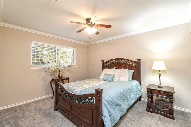 carpeted bedroom featuring a ceiling fan, crown molding, and baseboards