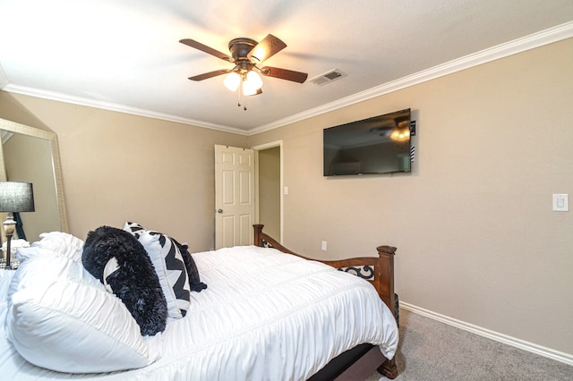 carpeted bedroom featuring crown molding, ceiling fan, visible vents, and baseboards