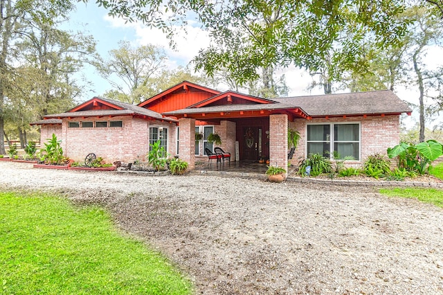 view of front of home featuring brick siding