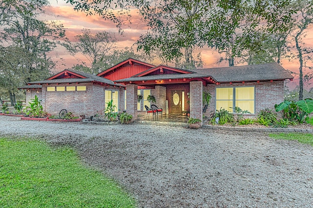 view of front of home featuring brick siding