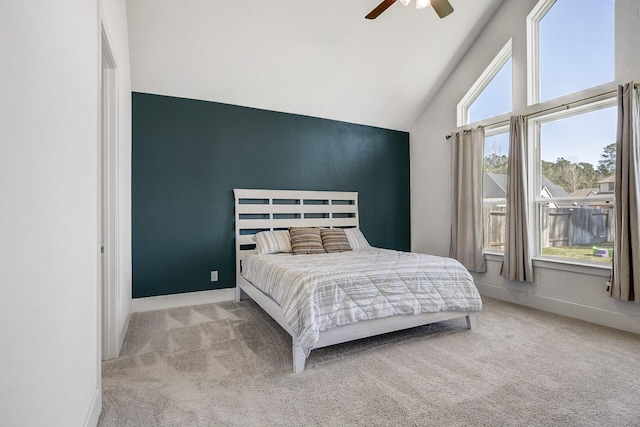 bedroom featuring vaulted ceiling, ceiling fan, baseboards, and carpet floors