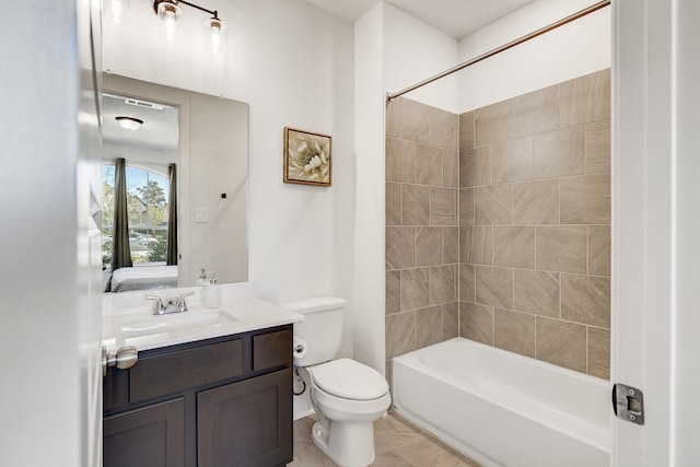 ensuite bathroom featuring vanity, shower / bathing tub combination, tile patterned floors, toilet, and connected bathroom