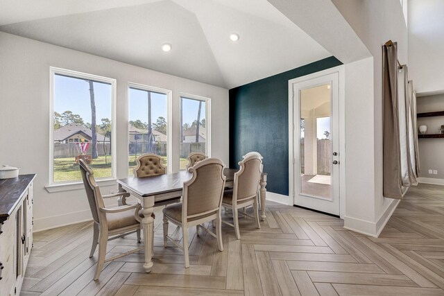 dining space featuring recessed lighting, baseboards, and vaulted ceiling