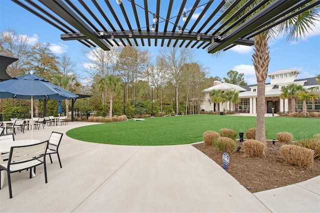 exterior space with a patio area and a lawn