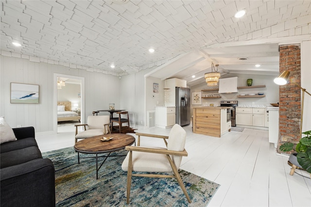 living room featuring brick ceiling, visible vents, light wood-style floors, and vaulted ceiling