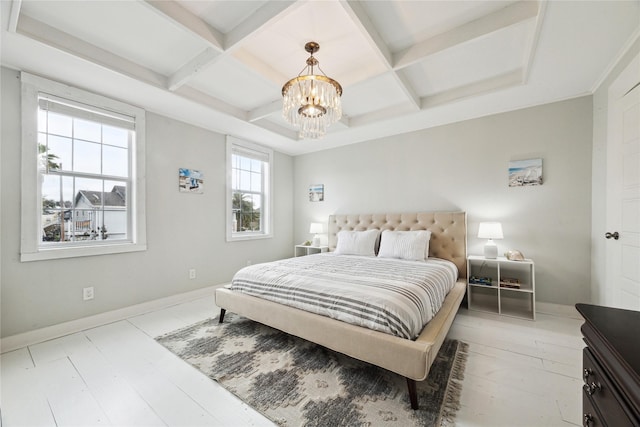 bedroom featuring a notable chandelier, baseboards, and coffered ceiling