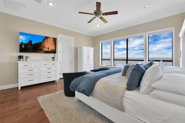 438 S Burnett Dr, Baytown, TX 77520 - bedroom with baseboards, a ceiling fan, dark wood-style floors, ornamental molding, and recessed lighting