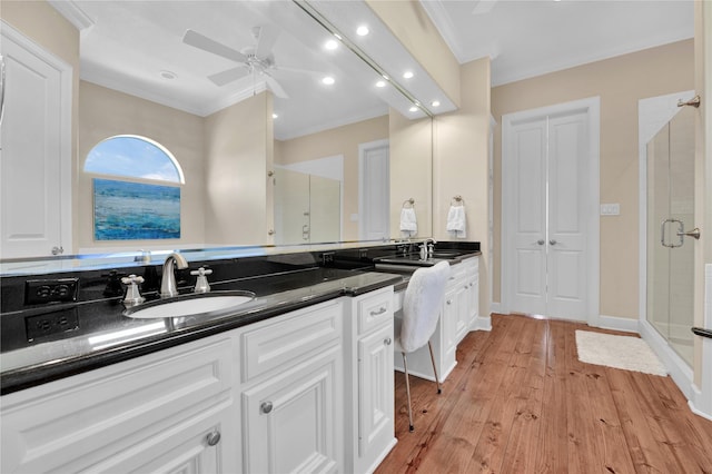 438 S Burnett Dr, Baytown, TX 77520 - full bath featuring crown molding, a stall shower, ceiling fan, vanity, and hardwood / wood-style flooring