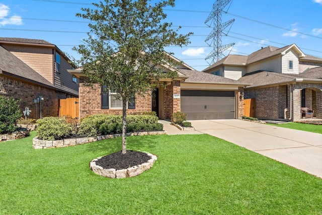 view of front of house featuring brick siding, roof with shingles, a garage, driveway, and a front lawn