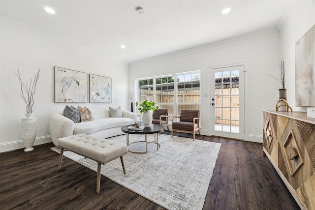 living area with recessed lighting, baseboards, dark wood finished floors, and ornamental molding