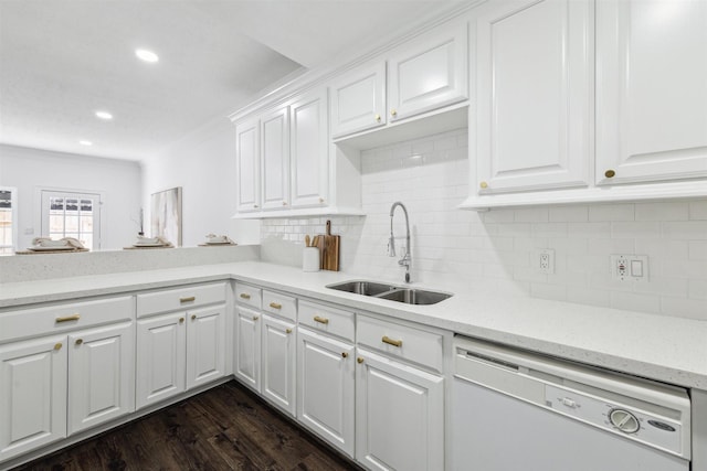 kitchen featuring tasteful backsplash, dark wood-type flooring, white cabinetry, white dishwasher, and a sink