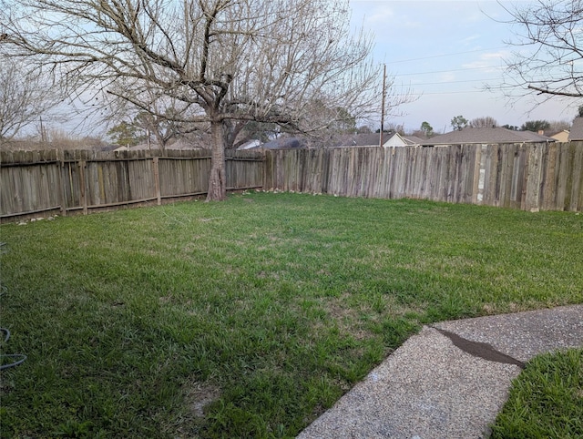 view of yard featuring a fenced backyard