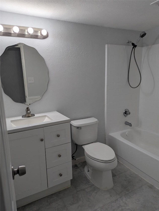 bathroom featuring bathtub / shower combination, a textured wall, toilet, vanity, and a textured ceiling