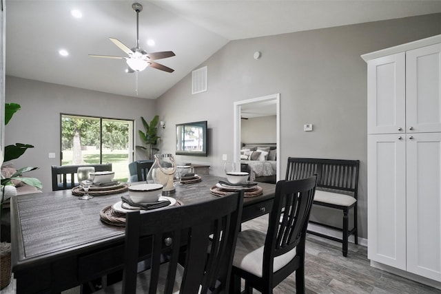 dining area with visible vents, a ceiling fan, vaulted ceiling, light wood-style floors, and recessed lighting