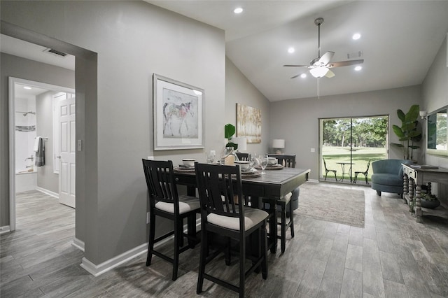 dining area featuring baseboards, visible vents, and wood finished floors