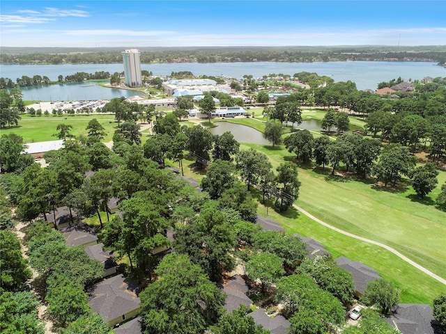 birds eye view of property featuring view of golf course and a water view