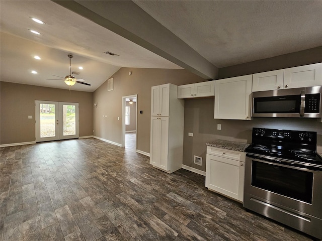 kitchen featuring visible vents, dark wood-style floors, stainless steel appliances, french doors, and white cabinetry