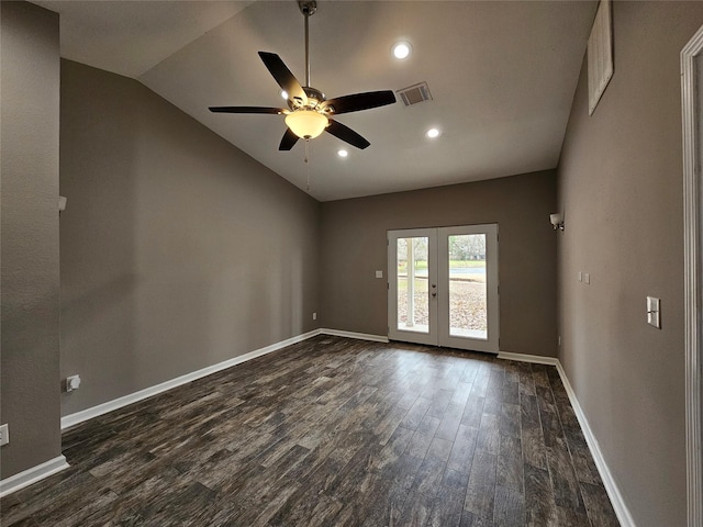 empty room featuring dark wood-style flooring, visible vents, baseboards, vaulted ceiling, and french doors