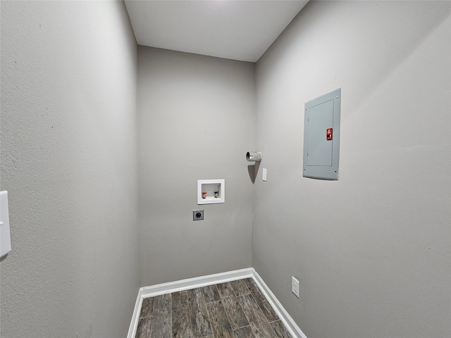 clothes washing area featuring laundry area, electric panel, wood finished floors, hookup for an electric dryer, and washer hookup