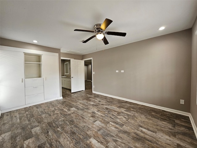 unfurnished bedroom featuring dark wood-type flooring, recessed lighting, ceiling fan, and baseboards