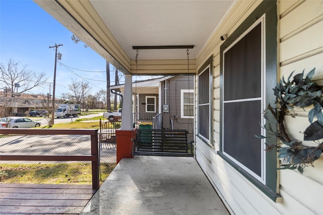 view of patio / terrace with covered porch and fence