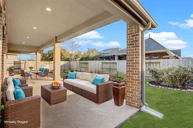 view of patio / terrace with a fenced backyard and an outdoor living space