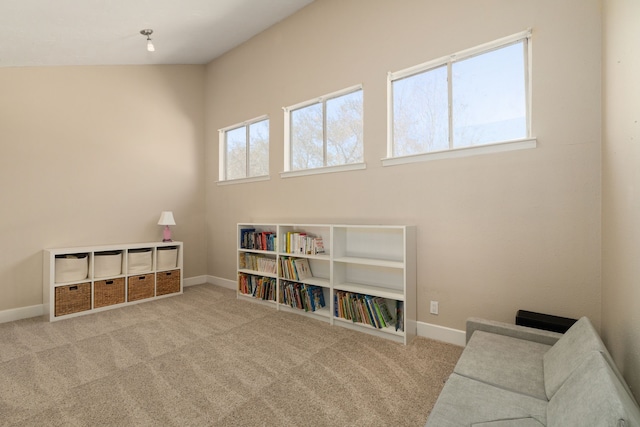 living area with carpet and baseboards