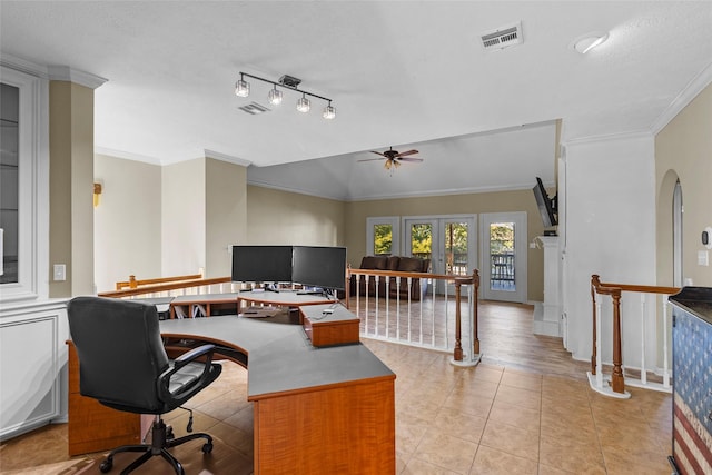 office featuring arched walkways, french doors, light tile patterned floors, visible vents, and ornamental molding