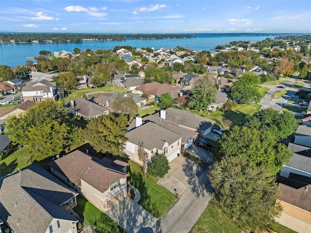 drone / aerial view with a residential view and a water view