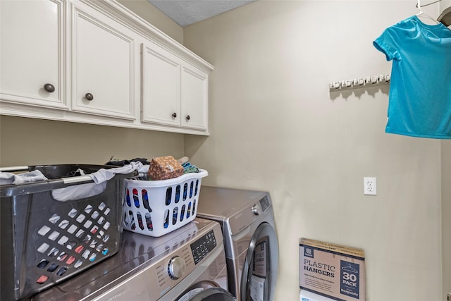 laundry area featuring cabinet space and washing machine and dryer