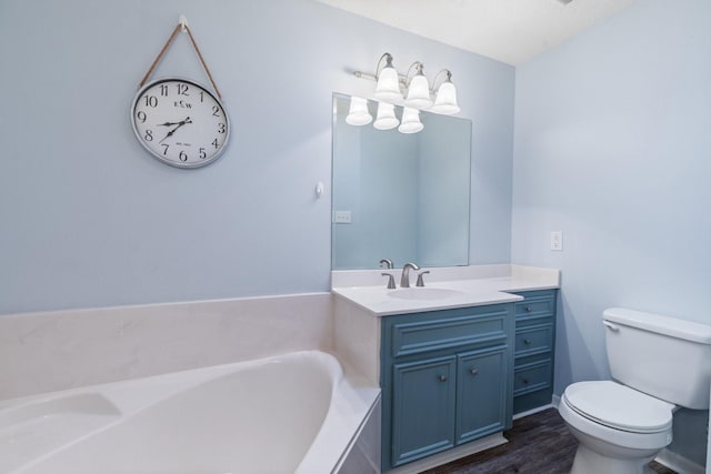 full bath featuring wood finished floors, vanity, toilet, and a bath