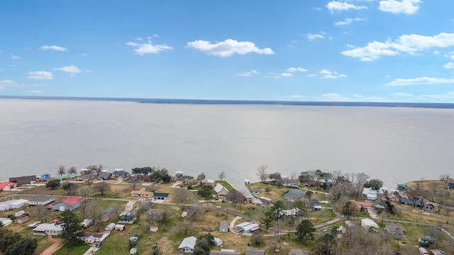 drone / aerial view with a water view and a residential view