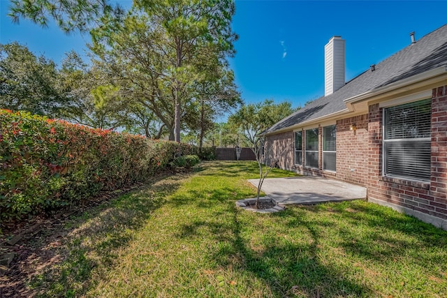 view of yard featuring a patio area and a fenced backyard