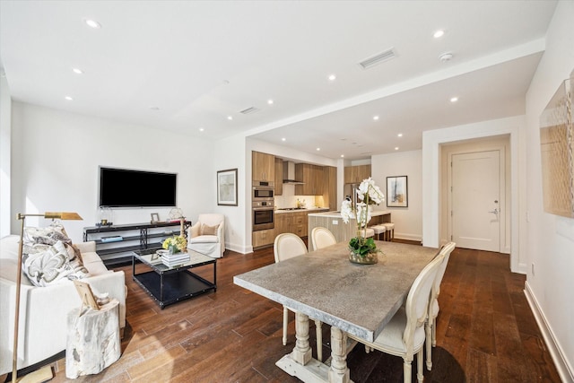 dining area with visible vents, baseboards, dark wood-type flooring, and recessed lighting