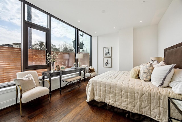 bedroom featuring multiple windows, wood finished floors, and recessed lighting