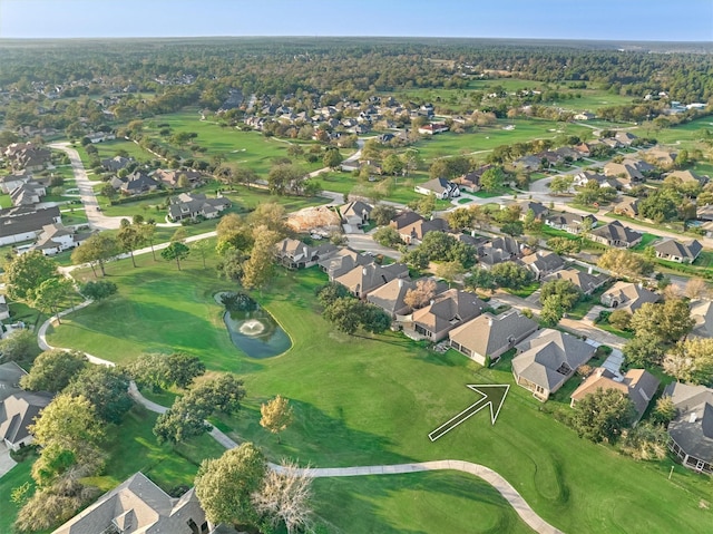 birds eye view of property with golf course view and a residential view