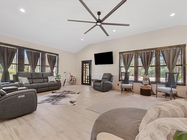 living room featuring lofted ceiling, recessed lighting, light wood-style floors, and ceiling fan