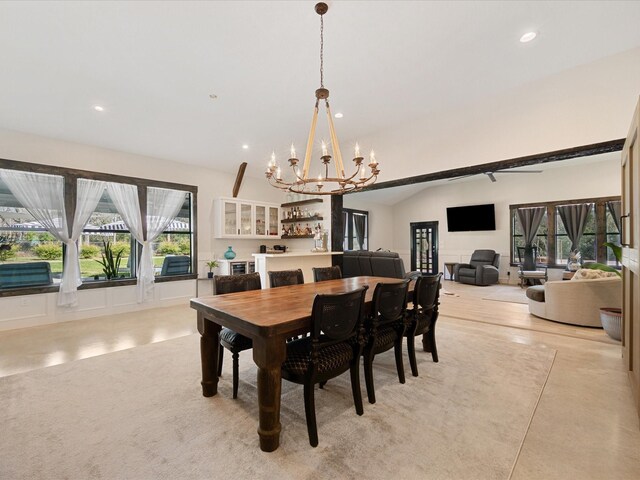 dining space with recessed lighting, a notable chandelier, concrete floors, and vaulted ceiling