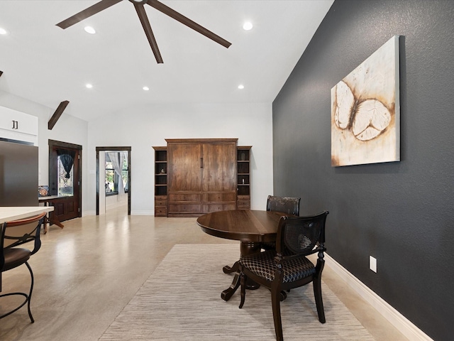 dining room with baseboards, concrete flooring, and ceiling fan