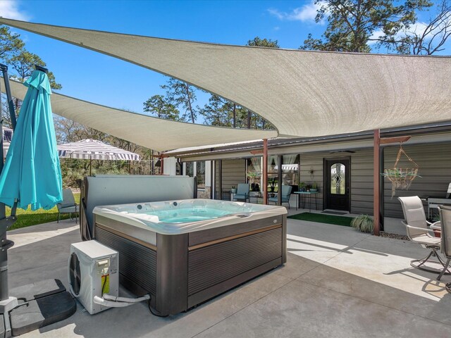 view of patio with a hot tub