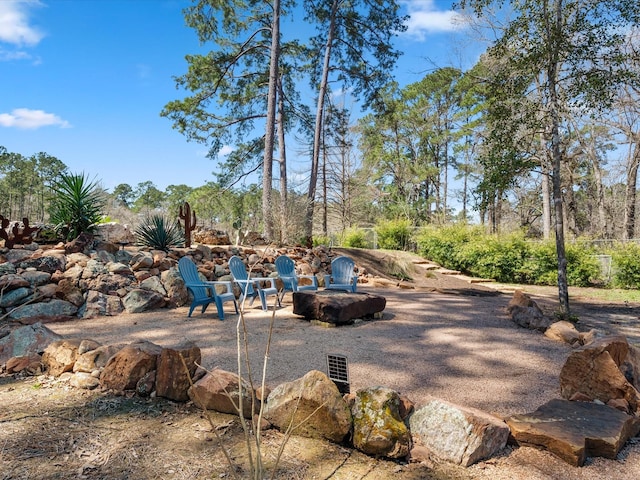 view of patio featuring an outdoor fire pit