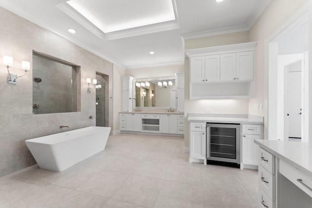 full bathroom with ornamental molding, beverage cooler, vanity, and a walk in shower