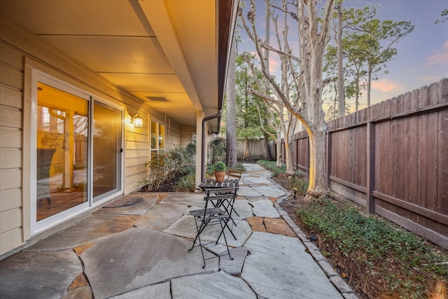 view of patio / terrace with a fenced backyard and visible vents