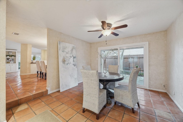 dining area featuring ceiling fan, visible vents, and baseboards