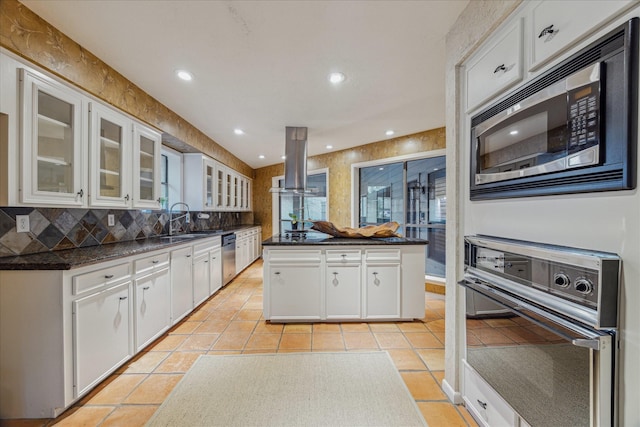 kitchen featuring light tile patterned flooring, a sink, a kitchen island, appliances with stainless steel finishes, and island exhaust hood