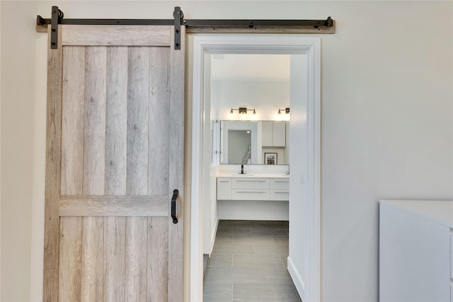 bathroom featuring vanity and baseboards