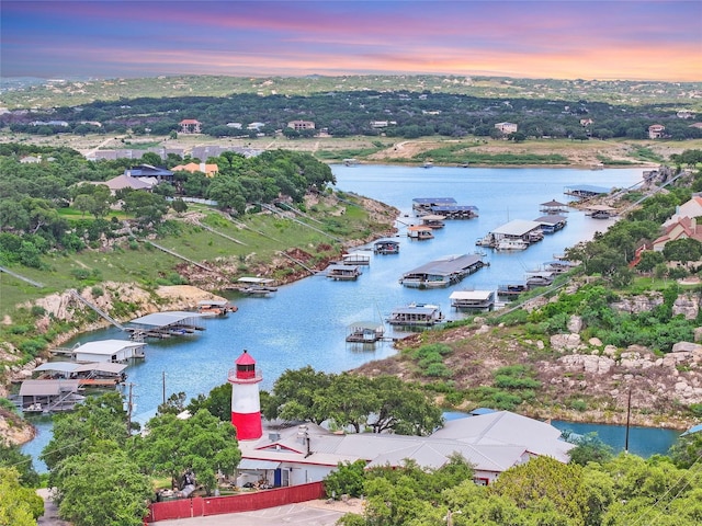 aerial view at dusk with a water view