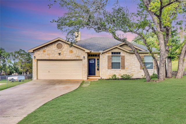 ranch-style home with driveway, a garage, a lawn, roof with shingles, and fence